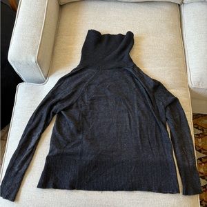 Dark gray long sleeve turtle neck sweater made from alpaca wool